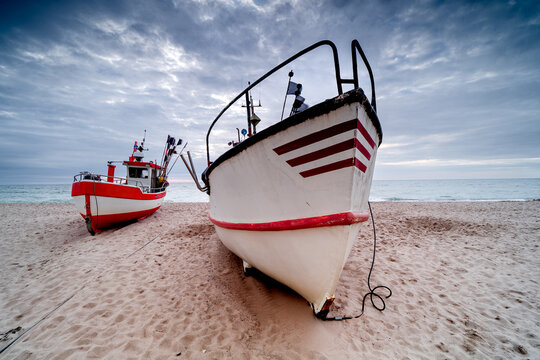Fishing boats on a sandy beach in Poland, beautiful landscape Polish coast, Baltic Sea, Western Pomerania, Dąbki.