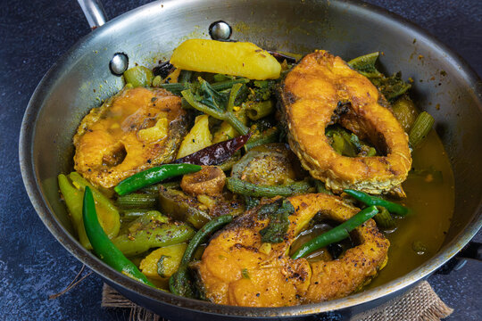 Title
Bengali Style Rui Fish Curry with Seasonal Vegetables Served in Kadai Traditional Indian Rohu Fish Curry Home Style Meal