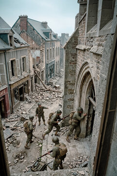 American GIs Advance through a war torn French town