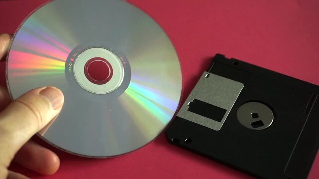 Comparison between obsolete data storage technologies, a cd and a floppy disk