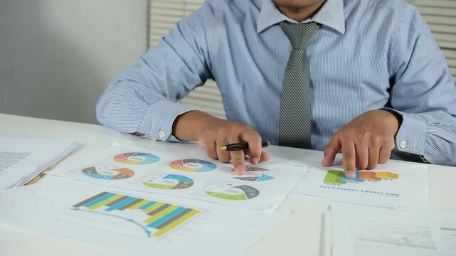 Finger Hand Paper Chart Graph Business Analysis Report Data Office Person Close up Document Statistics Finance Presentation Workspace Desk Colorful Pie chart Bar chart Information Study Planning

