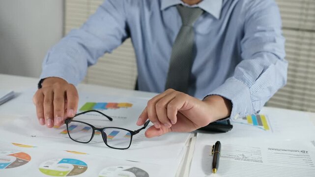 Putting his glasses on his desk, his eyes started to get tired from working all day in front of his laptop.