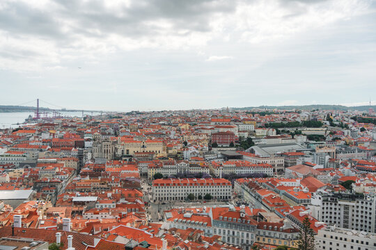 Panoramic view overlooking the sea of terracotta roofs across the historic city center of Lisbon, Portugal