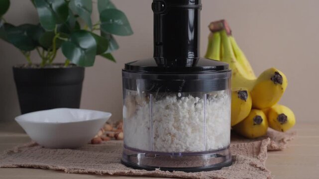 Preparing healthy breakfast in food chopper with cottage cheese and banana. Nutritious homemade meal and healthy lifestyle concept