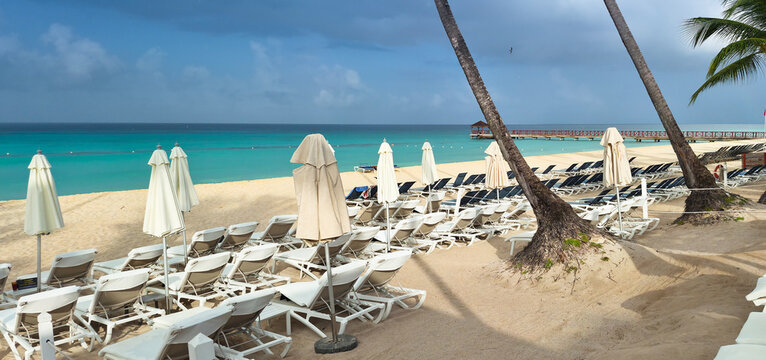 Dominicus beach after rain, white sand beach and dark sky. Dominican republic