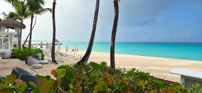 Dominicus beach after rain, white sand beach and dark sky. Dominican republic