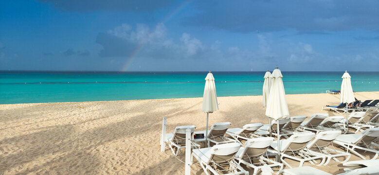 Dominicus beach after rain, white sand beach and dark sky. Dominican republic