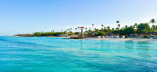 Obraz premium Dominicus beach with white sand, palms and light house. Dominican republic 