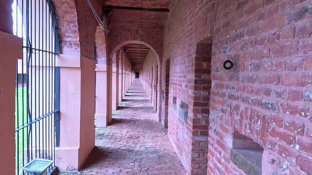 27/8/2025 showcasing the red brick archway corridor and cell entrances of the historic Cellular Jail (Kala Pani) in Port Blair, Andaman and Nicobar Islands. The footage highlights the architecture