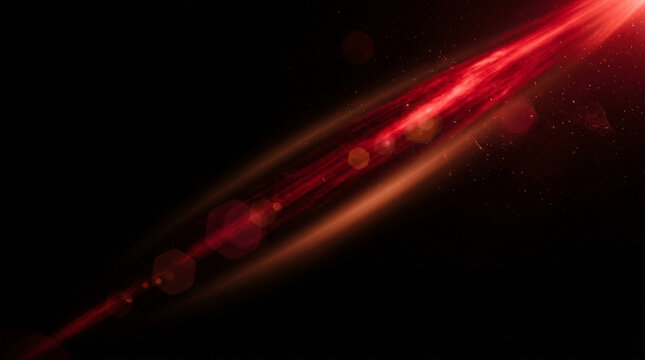 Bright red light flare with lens artifacts and glowing particles on a dark black background