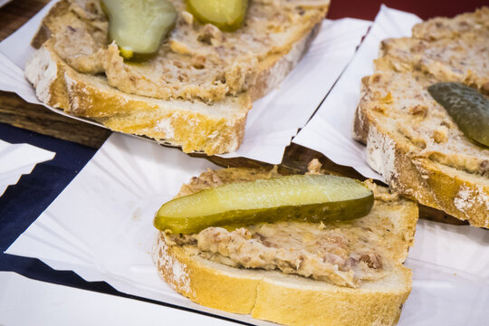 Fresh portion of wheat or rye bread with homemade lard with pickled cucumber