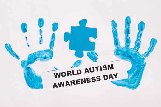 Kid handprint made of paint and inscription World Autism Awareness Day. Autism Spectrum Disorder