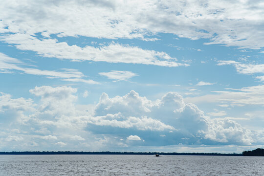 Amazon River with a blue sky full of clouds