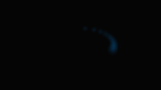 A single faint glowing blue light emerging from a deep and total darkness
