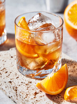 old fashioned cocktail with orange slice garnish