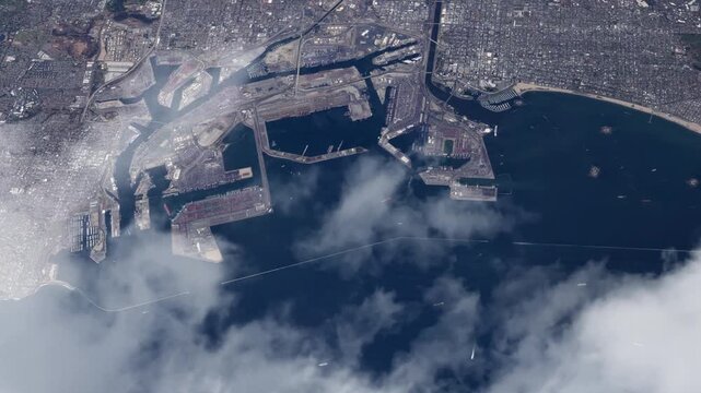 Flying over Long Beach Harbor and Port of Los Angeles with passing clouds based on Nasa imagery