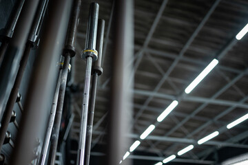Fototapeta premium standing barbells in a crossfit gym 