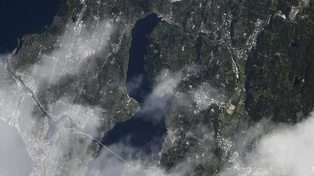 Flying over Seattle with passing clouds satellite view of Puget Sound and Lake Washington based on Nasa imagery