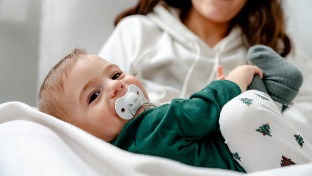Baby enjoying cozy moment in festive attire