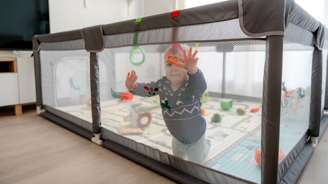 Baby enjoying quality time safely in a playpen