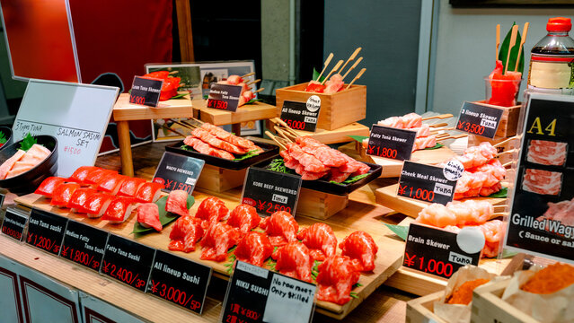 Kuromon Ichiba Market restaurant dish display in Osaka