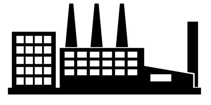 a long factory with four smokestacks