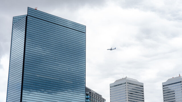 Modern buildings with plane near Osaka Castle Park