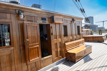 Wooden cabin and bench on the deck of a classic sailing ship in Antwerp, Belgium © kristof Leffelaer