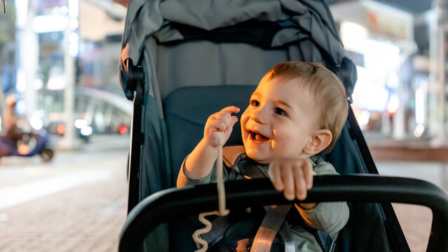 Happy baby exploring Liuhe Night Market in stroller