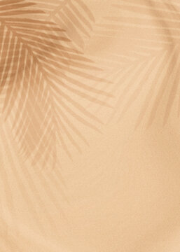 Palm leaves shadow on a beige background