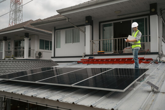 Solar Panel Installation Inspection by Engineer on Residential Home Rooftop with Clipboard