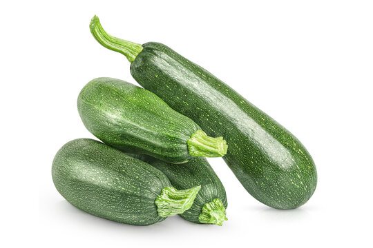 Four fresh green zucchini on transparent background.
