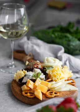 White wine with cheese board and pretzel snack platter