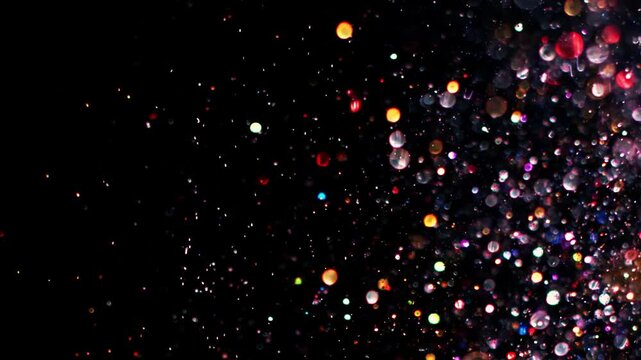 Particle gold dust flickering on black background. Gold Particles Moving Background. Gold Dust Waves. Particle from below. 4k abstract Footage background for text.	