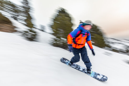Snowboarder speeds down snowy slope in the Pyrenees