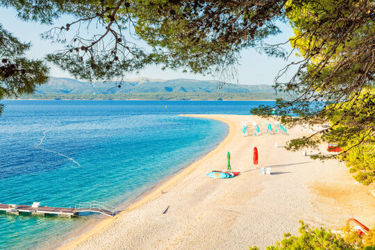 Famous Zlatni Rat sandy beach surrounded by turquoise Adriatic sea water on Brac Island, Dalmatia, Croatia.Beach tourism, outdoor leisure, island vacations, nature exploration and European travel