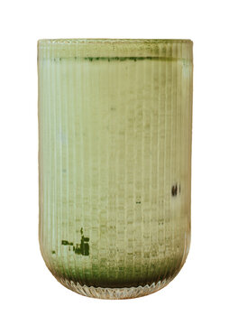 Iced matcha latte in a ribbed glass isolated on transparent background
