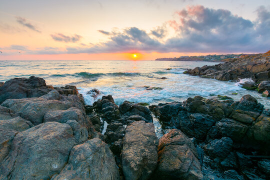 sea landscape at sunrise. rocky coast of bulgaria in summer. dramatic travel background with epic sky