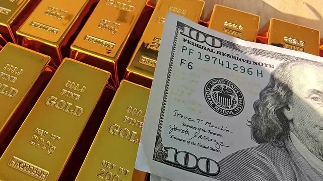 Exploring gold bars and cash in a safe deposit location