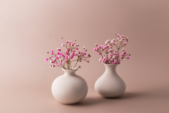 Elegant vases with delicate pink flowers