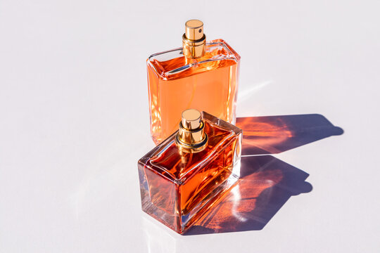 Elegant perfume bottles with rich golden hue