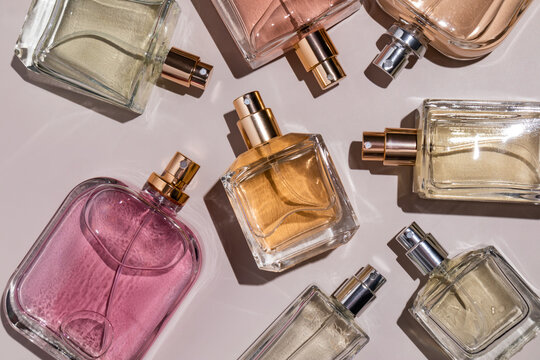 Assorted perfume bottles arranged on a flat surface