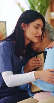 Picture frame, caregiver and hug old woman with grief for compassion, loss and comfort in homecare. Photo, carer and embrace senior widower in home for mourning, emotional support or assisted living