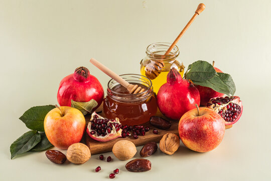 Symbols of Rosh Hashanah celebration with kosher treats