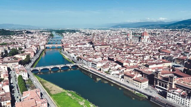 Aerial view of Florence Lungarni with iconic Ponte Vecchio bridge on a beautiful spring sunny day over Arno River