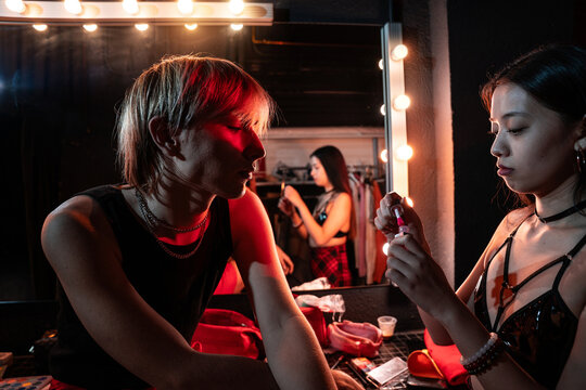 Actors preparing backstage in dressing room before show