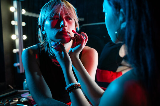 Actor getting makeup backstage before theater performance