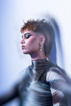 Studio fashion portrait of young woman with edgy style