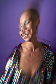 Middle aged shaved-head fashion model in motion blur