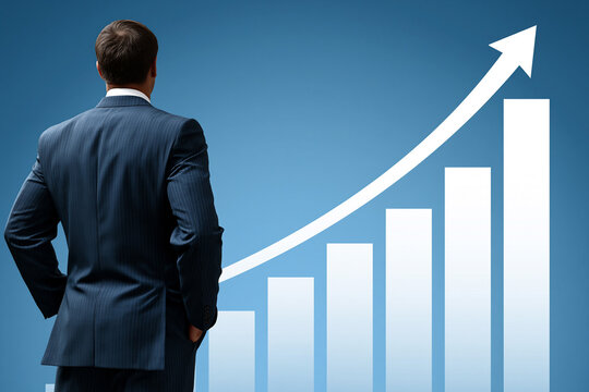 Businessman studies growth chart in office